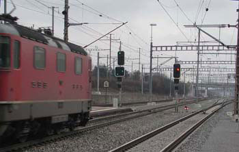 Eastbound train about to traverse crossover to express track on left